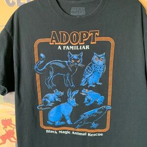Steven Rhodes Adopt a Familiar Black Graphic T-Shirt
